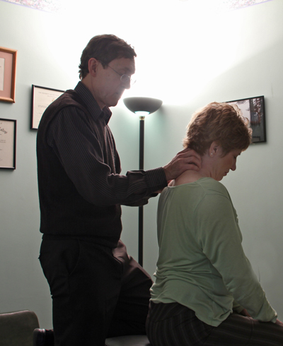 Dr Maryott Treating a patient using Chiropractic manipulation